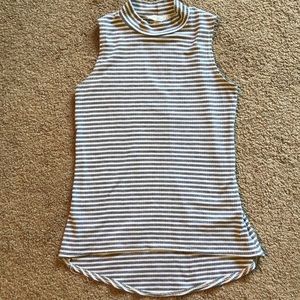Sleeveless, grey and white mock turtleneck